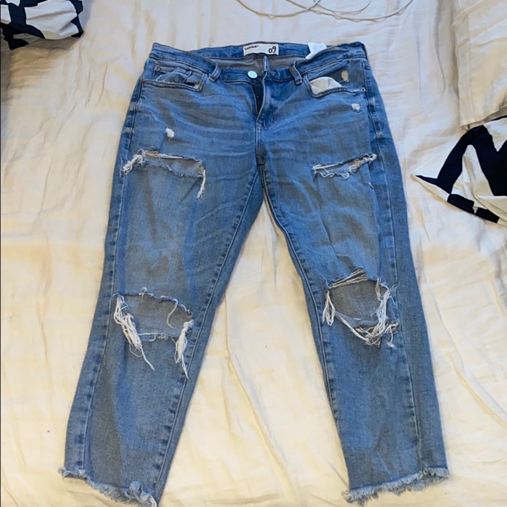 Distressed light blue jeans